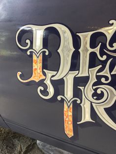 the letters b and f are painted on an old car