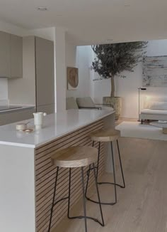 the kitchen is clean and ready to be used as a living room or dining area