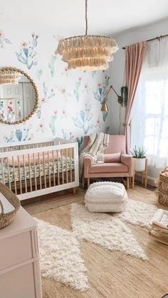 a baby's room decorated in pastel colors with cactus wallpaper and pink furniture