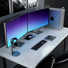 an apple computer sitting on top of a white desk