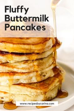 stack of fluffy buttermilk pancakes with syrup drizzled on top