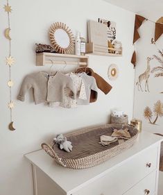 a baby's crib with toys and decorations on the wall