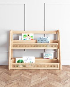 two wooden shelves with books on them against a white wall