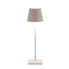 a white lamp with a beige shade on it