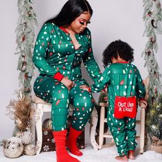 a woman and child wearing matching christmas pajamas