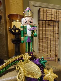 a mardi gras nutcracker is sitting on the table