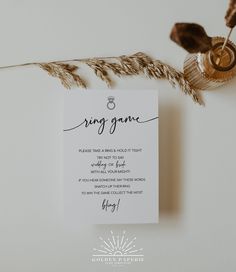 the wedding ring game is displayed on top of some dried grass and an ornament