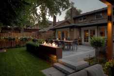 an outdoor patio with fire pit and seating area