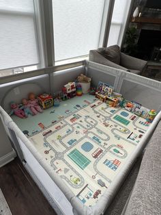 a child's playpen with toys in it