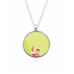 a necklace with an image of a man holding a soccer ball on it's back