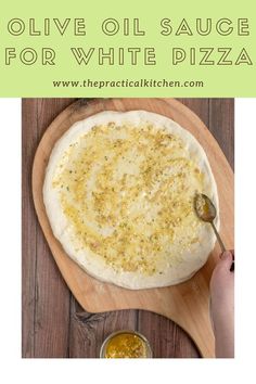 homemade olive oil sauce for white pizza on a wooden board with text overlay that reads olive oil sauce for white pizza