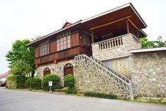 an old house with stone walls and stairs