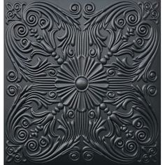 an intricately designed ceiling tile in black