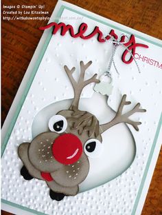 a christmas card with a reindeer ornament on it