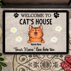 a welcome mat with a cat on it