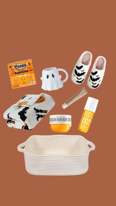 the contents of a baby's diaper laid out on a brown background, including shoes, socks and other items