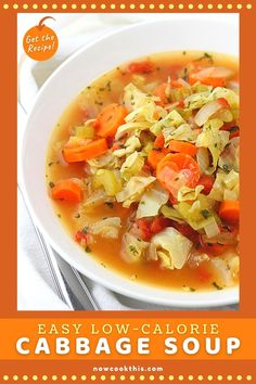 a white bowl filled with cabbage and carrots on top of a table next to a fork