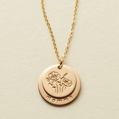 The “Nora” is a beautiful piece designed to carry more. For the 1/2” top disc, you’ll choose between MBM’s original design stamps — from birth flowers to a rainbow, the choice is yours. For the second disc choose up to 7 characters to stamp initials, a name, a date, etc. to line the edge of the disc. Gold Bar Necklace Personalized, August Flowers, Mary Necklace, Lace Choker Necklace, Made By Mary, Gold Disc Necklace, Dainty Choker, Gold Bar Necklace, Hand Stamped Jewelry