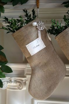 two burlock stockings hanging from a mantel