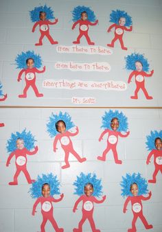 a bulletin board with pictures of people in red and blue costumes