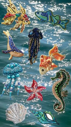 an assortment of sea creatures floating on top of the ocean water in different colors and sizes