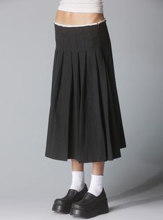 Low-waisted pleated skirt with a raw edge waistband. The drop waist and raw details turn the classic pleated skirt into a more sophisticated look. Secured by a zipper, perfect for belt layering. 55% Cotton 45% Tencel UWSK-1166 Imported Model is 5'9" and wearing a size S. Belt Layering, Unif Skirt, Thrifting Inspiration, Low Waisted Skirt, Pixie Skirt, Layered Mini Skirt, Fashion Articles, Low Waisted, Drop Waist