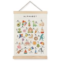 an alphabet poster hanging on a wall