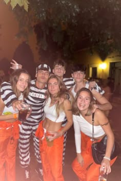 a group of people dressed in jail clothes