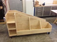 a wooden shelf sitting on top of a hard wood floor