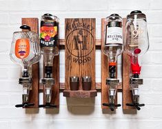 several different types of liquor on wooden racks