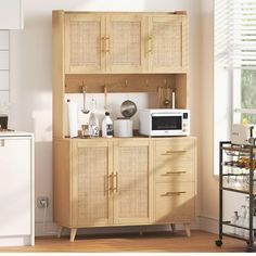 a kitchen area with a microwave, toaster and other items on the cabinet doors