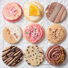 an assortment of different flavored cookies on white paper