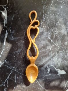 a wooden spoon sitting on top of a marble counter