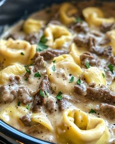 a close up of a casserole dish with meat and cheese