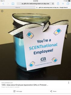 a blue jar with a sign on it that says you're a scentistaial employee