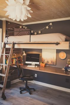 a loft bed with desk and ladder in a room that has wood flooring on the walls