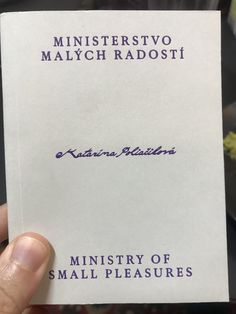 a person holding up a piece of paper with the words minnesota radosti written on it