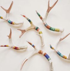 four antlers with different colored stripes on them