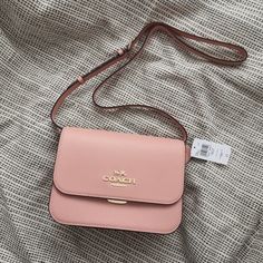 New Coach Brynn Flap Crossbody C5632 Gold/Shell Pink $350 Crossgrain Leather Inside Zip Pocket Buckle Closure, Fabric Lining Outside Zip And Open Pockets Adjustable Strap With 21 1/2" Drop For Shoulder Or Crossbody Wear 9 3/4" (L) X 7" (H) X 3 1/4" (W) Coach Purses For Teens, Feminine Bags With Branded Hardware, Elegant Spring Bags With Branded Hardware, Scooter Bags, Vintage Leather Handbag, Dream Bags, Inside My Bag, Coach Crossbody Purse, Bucket Handbags