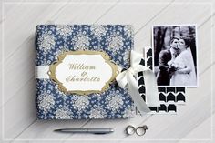 a wedding album with two photos on it and some scissors next to it, along with the couple's name