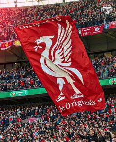 a large liverpool flag in the stands at anfield