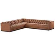 a brown leather sectional sofa with buttons on the back and armrests, in front of a white background