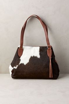 With rustic elegance and pockets galore, the Odessa cowhide shoulder bag offers a perfect marriage of practicality and style. Featuring silky hair-on cowhide with natural markings on the front and smooth cowhide leather everywhere else, this versatile and durable triple-compartment bag holds all your essentials with ease. Handbags Australia, Compartment Bag, A Perfect Marriage, Cowhide Purse, Luxury Leather Bag, Western Handbags, Cowhide Handbags, Leather Bag Pattern, Cowhide Bag