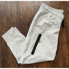 - Nike Sportswear Tech Fleece High-Rise Joggers - Brand New, Tags Attached - Size: Womens 1x (Standard Fit) - Lightweight - Elastic Waistband Fleece Pants With Side Pockets For Loungewear, Nike Joggers With Pockets For Fall, Nike Bottoms With Side Pockets For Loungewear, Nike Sweatpants With Pockets For Jogging, Nike Fleece Pants For Loungewear, Nike Activewear With Side Pockets For Loungewear, Nike Sweatpants With Pockets For Winter, Nike Sweatpants For Loungewear, Nike Joggers With Side Pockets