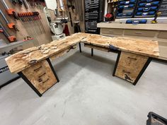 a workbench made out of plywood with tools in the background