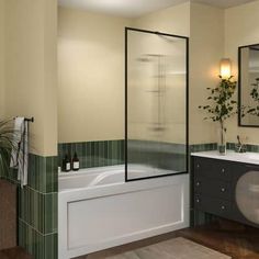 a bathroom with two sinks and a bathtub in the middle, along with a mirror on the wall