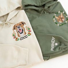 two green and white hoodies with embroidered dogs on the front, one has a dog's face