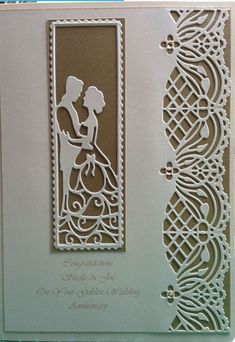 a wedding card with an image of a bride and groom on the front, cut out from paper