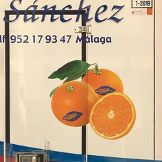 an advertisement on the side of a truck for oranges is shown in this image