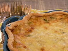 there is a pie on the table with silverware next to it and a fork